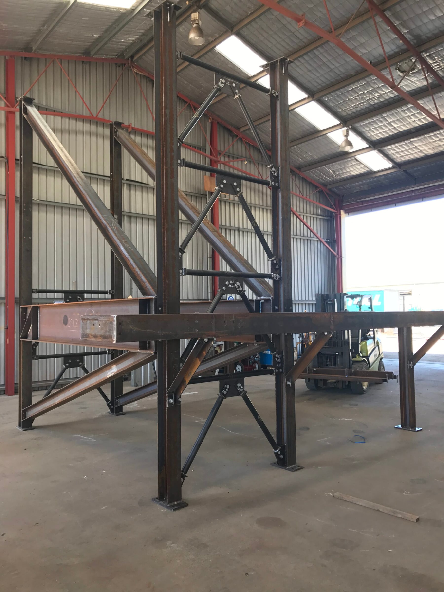 Structural steel portal frame with tension bracing, trial assembled in the Twomeys workshop