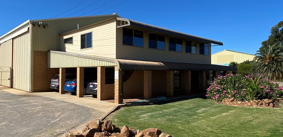The Twomeys office and workshop building on Flores Road, Geraldton, with the drive through shed alongside